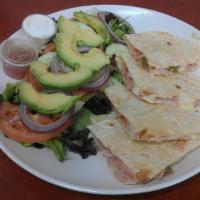 Quesadillas · Flour tortilla with cheese and your choice of meat.