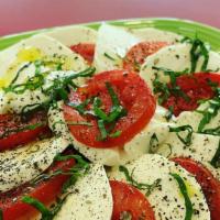 Caprese Salad · Fresh Mozzarella, Roma Tomatoes, Fresh Basil, with an extra virgin olive oil finish