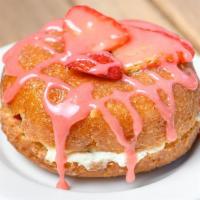 Strawberry Shortcake · Vanilla donut, filled with whipped cream, topped with strawberry icing & freshly cut strawbe...