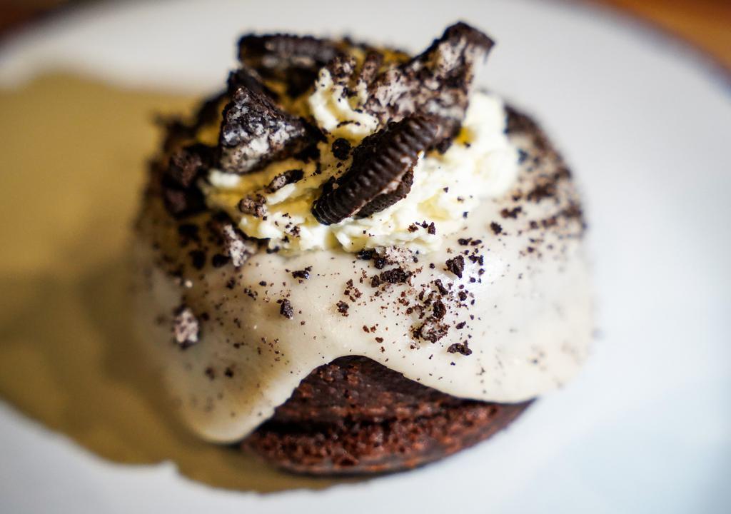 Cookies & Cream · Chocolate donut, vanilla icing, whipped cream, crushed Oreo's
