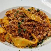 Pappardelle Bolognese · pasta with classic veal meat sauce.