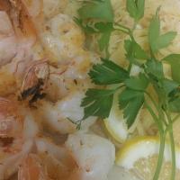 Shrimp Scampi · shrimp sautéed in a white wine garlic butter sauce & capellini