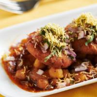 Ragda Patties · potato patties served on a bed of spiced chickpeas with finely chopped onions and tamarind c...