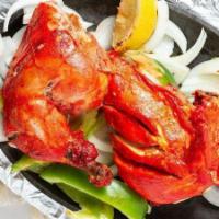 Tandoori Murgh Chicken · bone-in grilled chicken marinated in yogurt and red chili, coriander and cumin powder