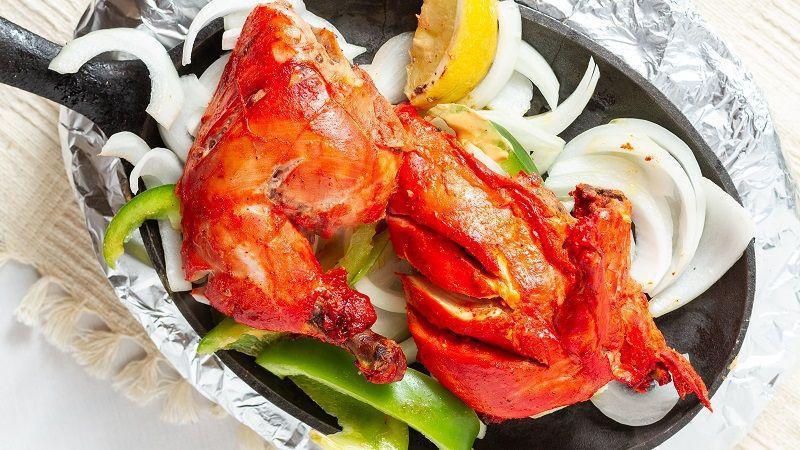 Tandoori Murgh Chicken · bone-in grilled chicken marinated in yogurt and red chili, coriander and cumin powder