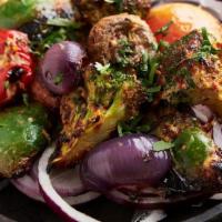 Mixed Tandoori Vegetables · grilled peppers, mushrooms, cauliflower, broccoli and eggplant marinated in a mild signature...