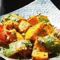Tandoori Paneer Tikka · cottage cheese marinated with mint and fenugreek served on a skewer with green peppers, broc...