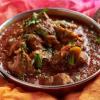 Lamb Rogan Josh · slow-cooked lamb in an onion gravy (excludes rice and naan)