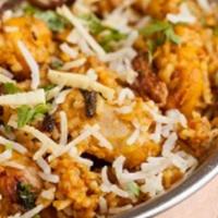 Chicken Biryani · slow cooked basmati rice prepared with herbs and saffron