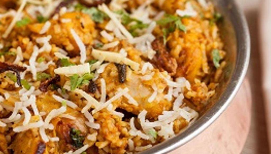 Chicken Biryani · slow cooked basmati rice prepared with herbs and saffron