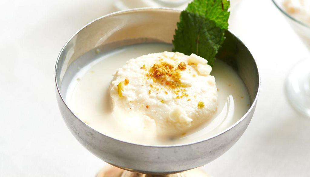 Rasmalai · cottage cheese, milk flavored with rose water, and garnished with nuts