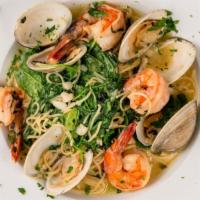 Capellini Messina · Shrimp, clams, fresh arugula and garlic and olive oil over capellini.
