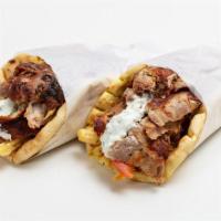 Lamb Gyro Pita Sandwich · Marinated lamb served with shredded lettuce, diced tomatoes, chopped onions and house made t...