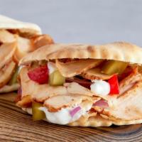 Spicy Chicken Gyro Pita Sandwich · Juicy chicken served with hot sauce, shredded lettuce, diced tomatoes, chopped onions and ho...