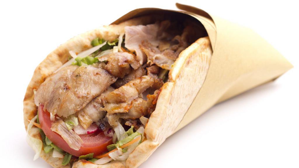 Chicken Gyro Pita Sandwich · Juicy chicken served with shredded lettuce, diced tomatoes, chopped onions and house made tzatziki sauce on pita bread.