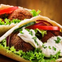 Falafel Pita Sandwich · Crispy chickpeas balls served with shredded lettuce, diced tomatoes, chopped onions and hous...