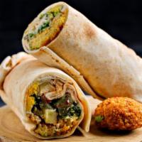 Spicy Falafel Pita Sandwich · Crispy chickpeas balls served with hot sauce, shredded lettuce, diced tomatoes, chopped onio...