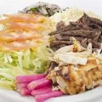 The Lamb Gyro Platter · Marinated lamb served with shredded lettuce, diced tomatoes, chopped onions and house made t...