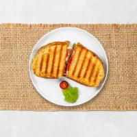 Seal The Grill Ham Panini · Ham, melted American cheese, lettuce, and tomato on toasted bread.