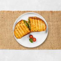 Turkey Pesto Panini · Turkey, pepper Jack cheese, lettuce and tomato on toasted bread.