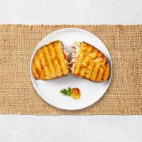 Turkey Turner Panini · Turkey breast, Swiss cheese, tomato, and mayo on toasted bread.