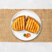 Pastrami Club Panini · Lean pastrami, melted Swiss cheese, red onions, and mustard on toasted bread.