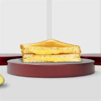 American Grilled Cheese · Melted American cheese and tomato placed in between two buttered pieces of bread and grilled...