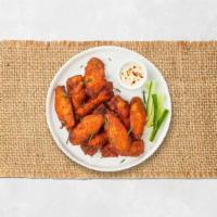 Crispy Classic Wings · Fresh chicken wings breaded and fried until golden brown. Served with a side of ranch.