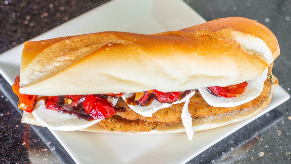 The Bloomfield Ave · Fresh breaded chicken cutlet, fresh mozzarella, homemade roasted peppers topped with balsamic glaze.