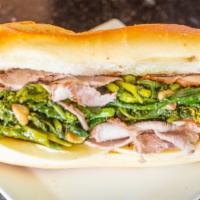 The Philly · Roast pork seasoned and cooked to perfection, topped with broccoli rabe and provolone