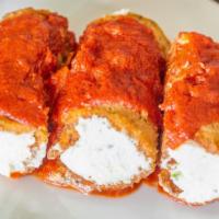 Eggplant Rollatini  · One of our most popular items. Eggplant done to perfection and in the middle is our deliciou...