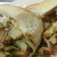 Italian Hot Dog · Newark-style two franks piled with grilled peppers, onions, potatoes, and spicy mustard on a...