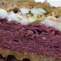 Hot Corned Beef Panini · Served with swiss, cole slaw and russian dressing on panini-grilled rye.