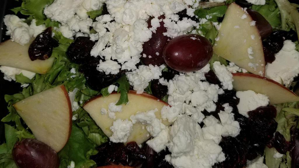 Raider Salad · Spring mix greens topped with craisins, sliced apples, crumbled feta cheese and grapes. Served with balsamic vinaigrette.