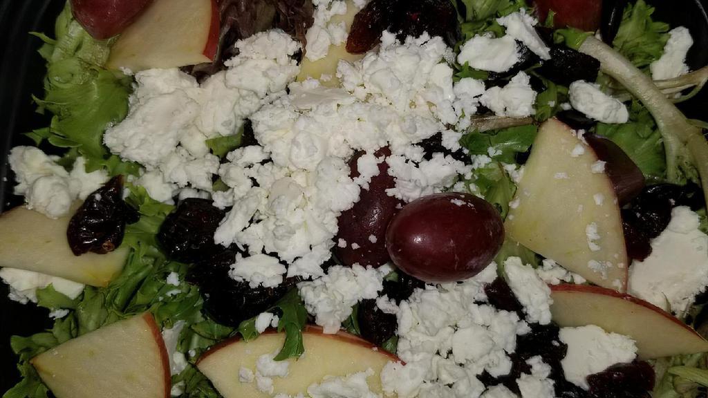 Raider Salad · Spring mix greens topped with craisins, sliced apples, crumbled feta cheese, and grapes. Served with balsamic vinaigrette.