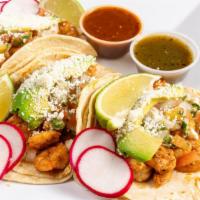 Shrimp Tacos · Topped with pico de gallo, avocado, choice of green, red or guacomole sauce.