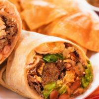 Steak And Chicken Burritos · Flour tortilla filled with rice, beans, cheese, lettuce, red sauce, and sour cream.