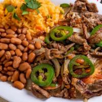Bistec A La Mexicana · Served with rice and beans. Grilled steak with onions, tomatoes and jalapenos.