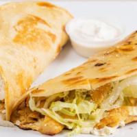 Chicken Quesadillas · Flour or corn tortilla with cheese, lettuce, Cotija cheese and sour cream.