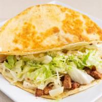 Al Pastor Quesadillas · Flour or corn tortilla with cheese, lettuce, Cotija cheese and sour cream.