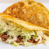 Spicy Pork Quesadillas · Flour or corn tortilla with cheese, lettuce, Cotija cheese and sour cream.