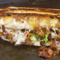 Al Pastor Torta · Traditional Mexican sandwich served on a telera toasted bread with refried beans, mayo, slic...