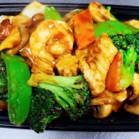 Triple Delight · Jumbo shrimp, scallop, crab meat, and vegetables with brown sauce.