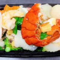 Seafood Delight · Crab meat, scallop, jumbo shrimp, and vegetables with white sauce.
