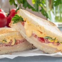 Manhattan Bridge Sandwich · Simple but satisfying sandwich of fresh, soft mozzarella cheese, roasted peppers, fresh toma...