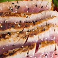 Seared Tuna Salad · Mix salad green with seared tuna and citrus dressing.