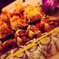 Godzilla Roll · Kani saled with cream cheese and avocado rolled with white fish deep fried topped spicy eel ...
