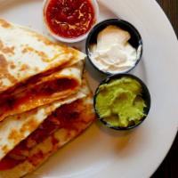 Chipotle Quesadilla · Grilled chicken, Cheddar cheese, red onion, and chipotle sauce. Served with sour cream.