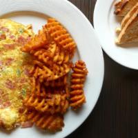 Western Omelette · Ham, peppers, and onions. Serves with homemade home fries and toast.