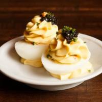 Deviled Eggs (4 Pcs) · Gluten-free. American sturgeon caviar, pickled mustard seeds, chives.